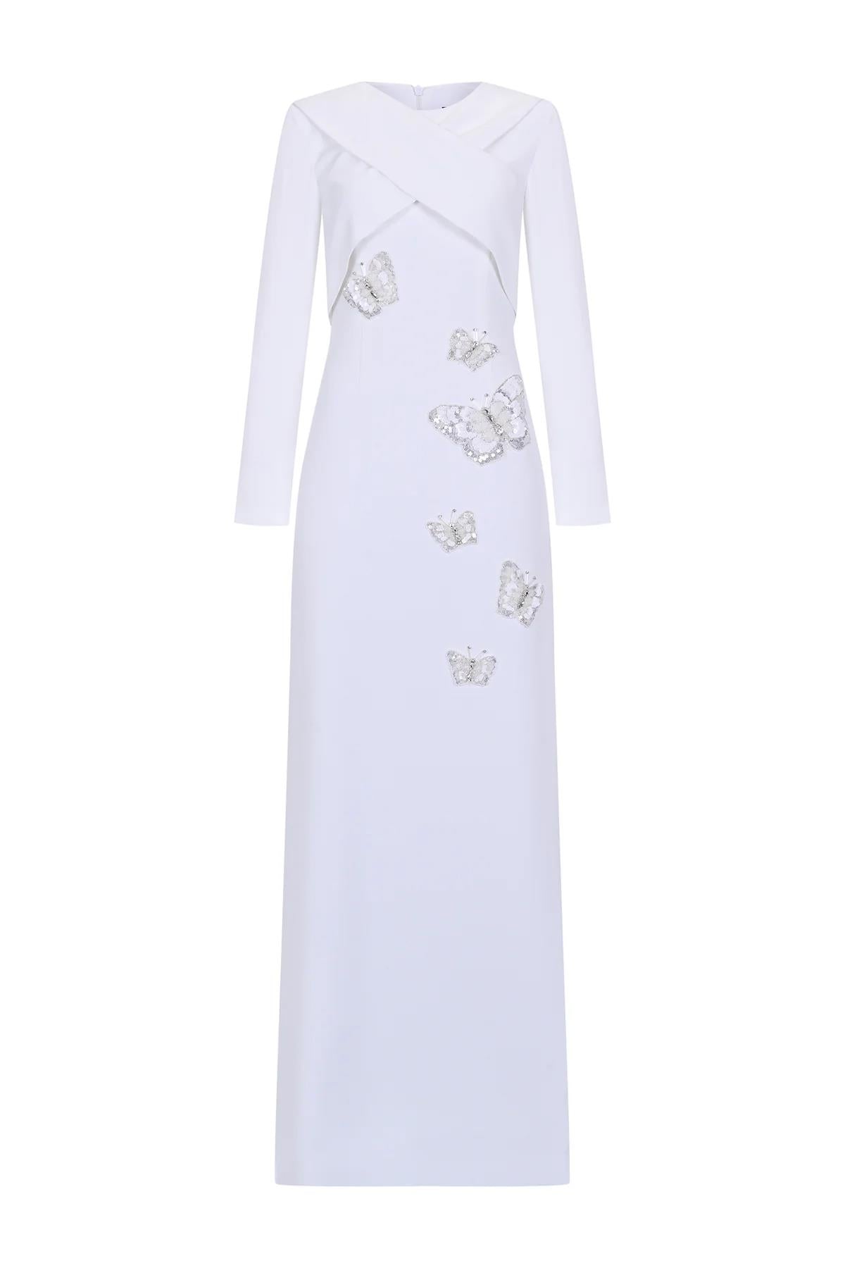 فستان سهرة مطرز بأكمام طويلة وقصّة غير متماثلة